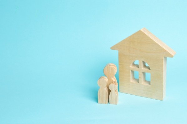 wooden shapes of house and family
