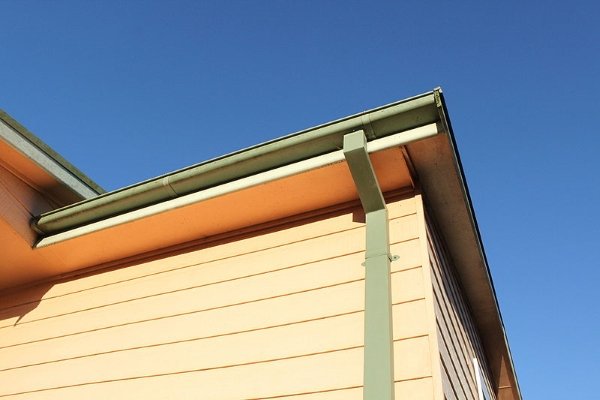a modern half round gutter system with a sturdy downspout